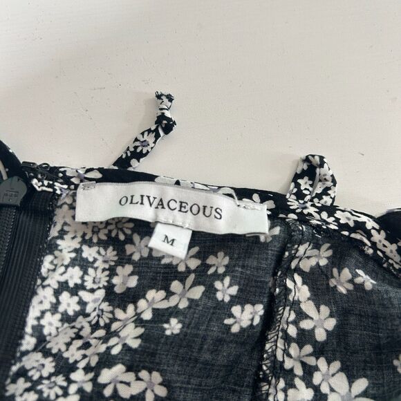 Olivaceous Black and White Floral Halter Tie Neck Open Back Flowy Romper Medium - Picture 8 of 11